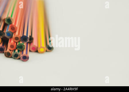 Multiple pencils of different colors to draw, stacked on a white background Stock Photo