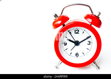 close up of a vintage red bell clock on white background Stock Photo
