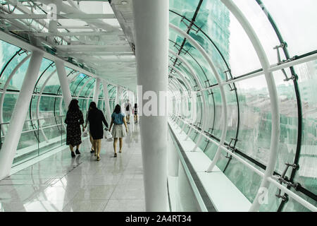 Singapore-08 OCT 2017: Orchard gateway shopping mall glass walk tunnel Stock Photo