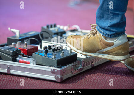 Young man playing on electric guitar close up Stock Photo