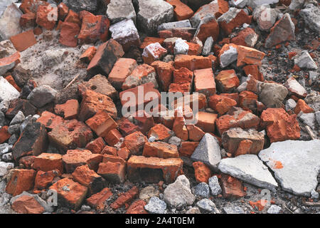 Pile of red bricks. Destruction, broken stone texture, old ruin. Debris. Stock Photo