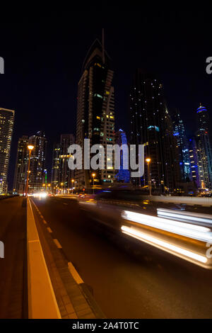View of the high-rise buildings of Dubai in the evening. Dubai Marina district. Stock Photo