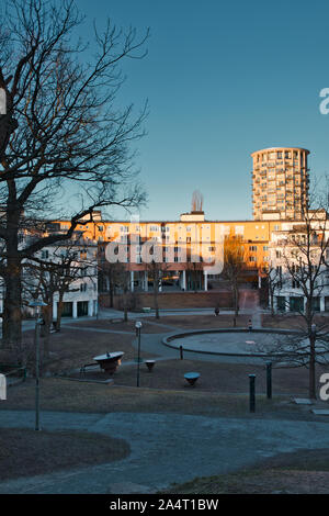 Circular park in residential district of Gardet with the Svea Tower circular luxury apartment building in the background, Gardet, Stockholm, Sweden Stock Photo