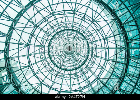 Looking through the circle glass roof from bottom Stock Photo
