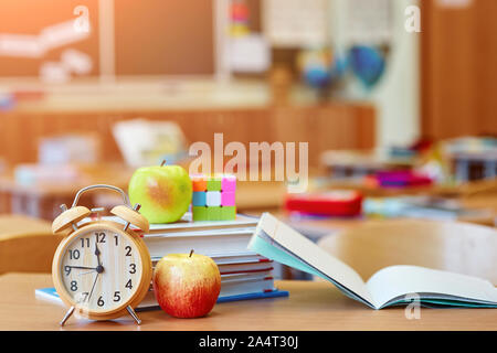 Class in a blurred background without children. Students left their backpacks and notebooks and went for a break Stock Photo