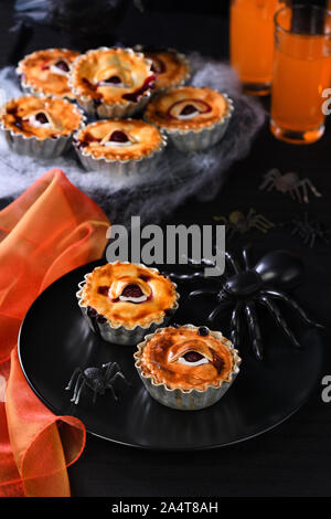 Halloween mini Creepy Eye Cakes with cherry filling Stock Photo