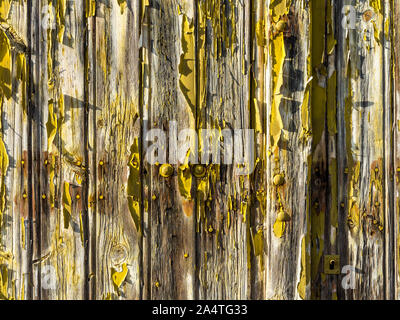 Peeling paint on old door - Le Petit Pressigny, France. Stock Photo