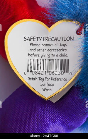 Safety Precaution please remove all tags and other accessories before giving to a child label tag on Ty soft toy Stock Photo