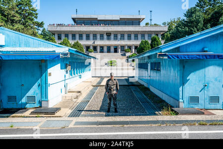 JSA Korea, 24 September 2019 : Border between the North and South Korea at the Joint Security Area or Panmunjom with blue huts and demarcation line in Stock Photo