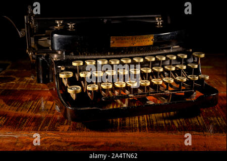 Berlin, Germany - October 16, 2019: Detail of a historic dusty portable typewriter made in Germany during the twenties of the 20th century. Stock Photo