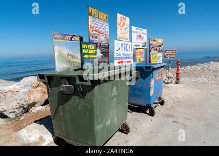 Gouves, Crete, Greece, October 2019.  Rubbish and recycling bins on the beach road in the seaside resort of Gouves, Crete.