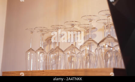 Lots of wine glasses on shelf. Empty wine glasses Stock Photo