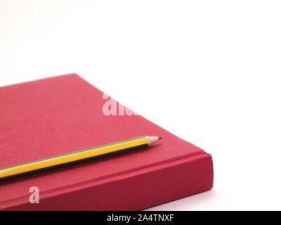 Red Book and Pencil , Placed on a white background. Stock Photo