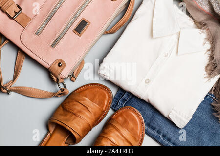 Lady clothes and personal accessories on a gray background Stock Photo