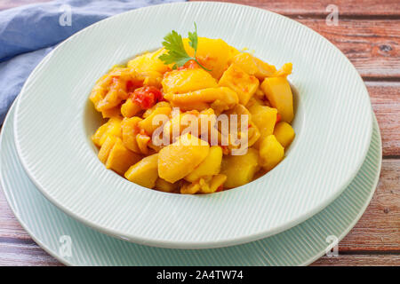 fresh stew potato and squid on sauce Stock Photo