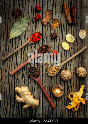 Ingredients for Chinese herbal soup on shabby wooden background . Stock Photo