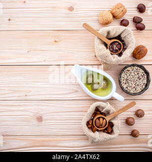 Ingredients for the healthy foods selection .Various different kinds of nuts set up on wooden table. Stock Photo