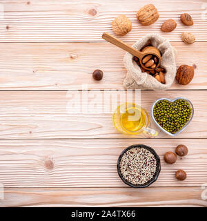 Ingredients for the healthy foods selection .Various different kinds of nuts set up on wooden table. Stock Photo