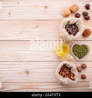 Ingredients for the healthy foods selection .Various different kinds of nuts set up on wooden table. Stock Photo
