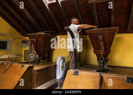 Old water driven mill where toasted corn is ground to make a flour called gofio in a traditional manner, La Orotava, Tenerife, Canary Islands, Spain Stock Photo