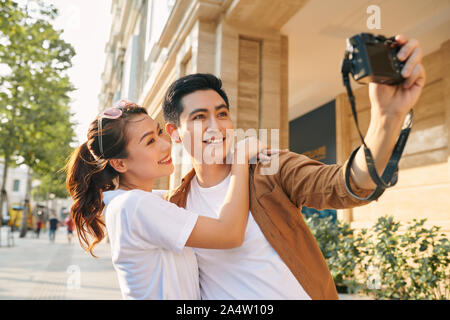 Happy tourists taking photo of themselves Stock Photo