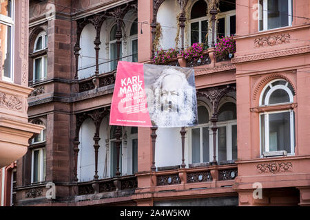 Trier, Germany. Banner with a picture of Karl Marx in his brithplace of Trier commemorating the 200th anniversary of his birth Stock Photo