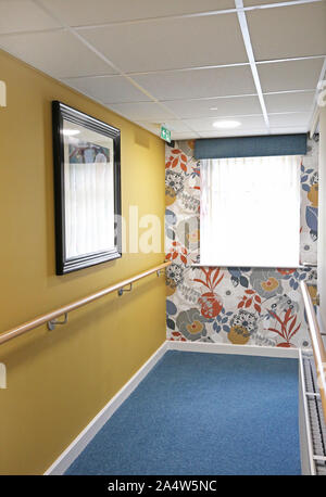 Access corridor in a newly refurbished care home near Wakefield, UK. Shows safety handrails and fire doors. Stock Photo