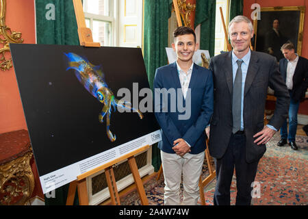 Minister at the Department for Environment, Food and Rural Affairs Zac Goldsmith meets winner of the Young Wildlife Photographer of the Year competition Cruz Erdmann (left) at a reception previewing images from the Natural History Museum's 55th Wildlife Photographer of the Year competition at Downing Street, London. PA Photo. Picture date: Wednesday October 16, 2019. See PA story ENVIRONMENT Photography. Photo credit should read: Dominic Lipinski/PA Wire
