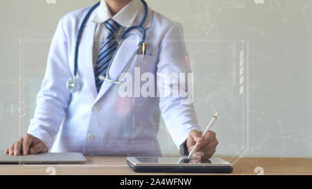 Woman doctor holding digital pencil and touching screen on smart device with medical icon Stock Photo
