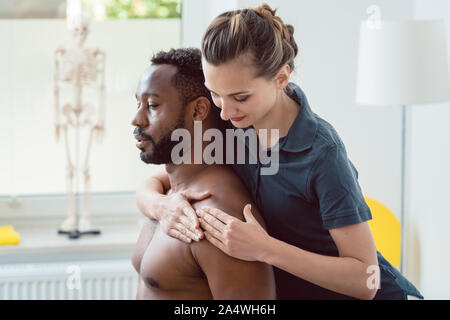 Remobilization of shoulder joint in the physical therapy Stock Photo