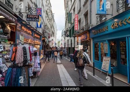 Paris, France - 2nd October, 2019: Tourists walk past busy hotels and restaurants in Rue de la Huchette in central Paris, France Stock Photo