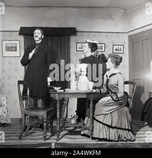 1965, historical, amateur actors on stage performing in the play, 'Gas Light', England, UK. The play, a thriller about marriage, set in Victorian London, was written in 1938 by British writer Patrick Hamilton. Stock Photo
