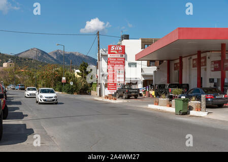 Neopolis, northern Crete, Greece. October 2019.  Peterol station on the Old National Road as driving into Neopolis a Cretan historic town. Stock Photo