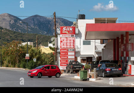 Neopolis, northern Crete, Greece. October 2019.  Peterol station on the Old National Road as driving into Neopolis a Cretan historic town. Stock Photo