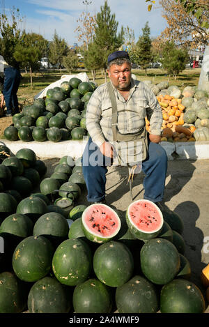 Melons and watermelons vendor. Chorsu Bazaar is the main bazaar located in the old town of Tashkent. Uzbekistan Stock Photo