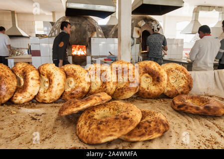 Traditional uzbek bread in a bakery. Chorsu Bazaar is the main bazaar located in the old town of Tashkent. Uzbekistan Stock Photo