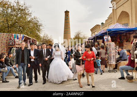 A wedding in the main street of the old town of Khiva, a very popular site for all the festivities in the town. Uzbekistan Stock Photo