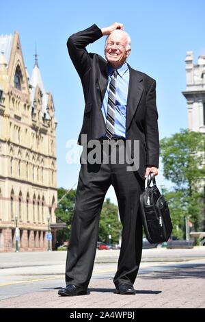 Stressed Adult Senior Business Man Standing Stock Photo