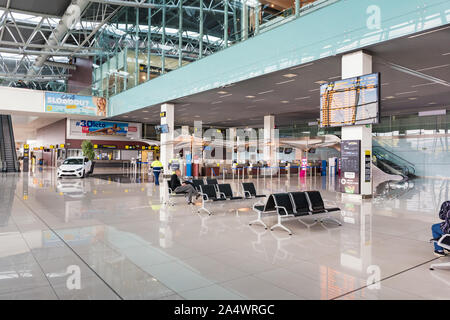 BRATISLAVA, SLOVAKIA – OCTOBER 6 2019: Almost empty Departure hall of Bratislava airport terminal. Passenger waits for his flight (Slovakia) Stock Photo