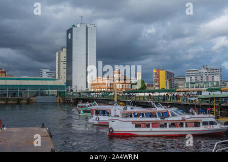 The busy Porto Flutante or floating habour with spped boats for touristic Amazon tours, Manaus, The Amazon, Brazil, Latin America Stock Photo