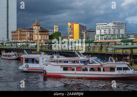 The busy Porto Flutante or floating harbour, speed boats for Amazon tours at the pier, city view of Manaus, The Amazon, Brazil, Latin America Stock Photo