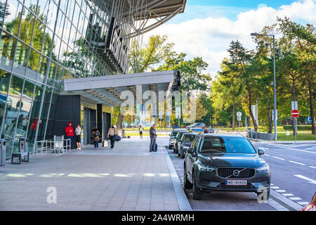 BRATISLAVA, SLOVAKIA – OCTOBER 6 2019: Passengers and cars in front of Departure hall of Bratislava airport terminal (Slovakia) Stock Photo
