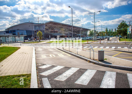BRATISLAVA, SLOVAKIA – OCTOBER 6 2019: View of Bratislava Airport terminal with parking lot full of cars (Slovakia) Stock Photo