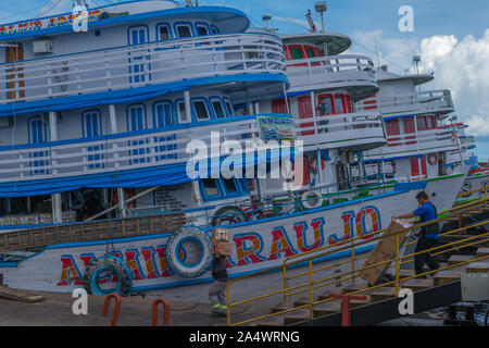 The busy Porto Flutante or floating habour, slow boats being loaded for their Amazon tour, Manaus, The Amazon, Brazil, Latin America Stock Photo