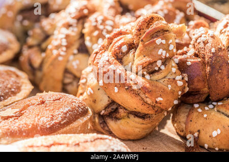 Close up of Swedish twisted cinnamon rolls with nib sugar and cardamom. Stock Photo