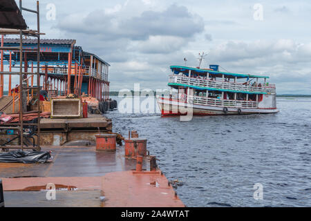 Porto Flutante or floating habour, slow boat leaving for her Amazon tour, Manaus, The Amazon, Brazil, Latin AmericaThe busy Porto Flu Stock Photo