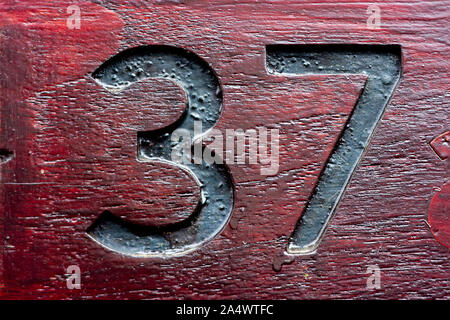 House number 37 engraved in wood Stock Photo