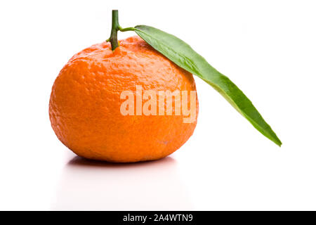 Single whole mandarin with stalk and leaf Stock Photo