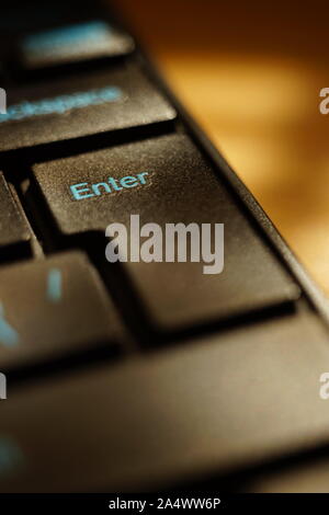 Black keyboard on the table closeup. Focus on key Enter Stock Photo