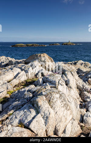 Rocky coastline and island at Rhoscolyn, Anglesey, North Wales on a sunny day Stock Photo